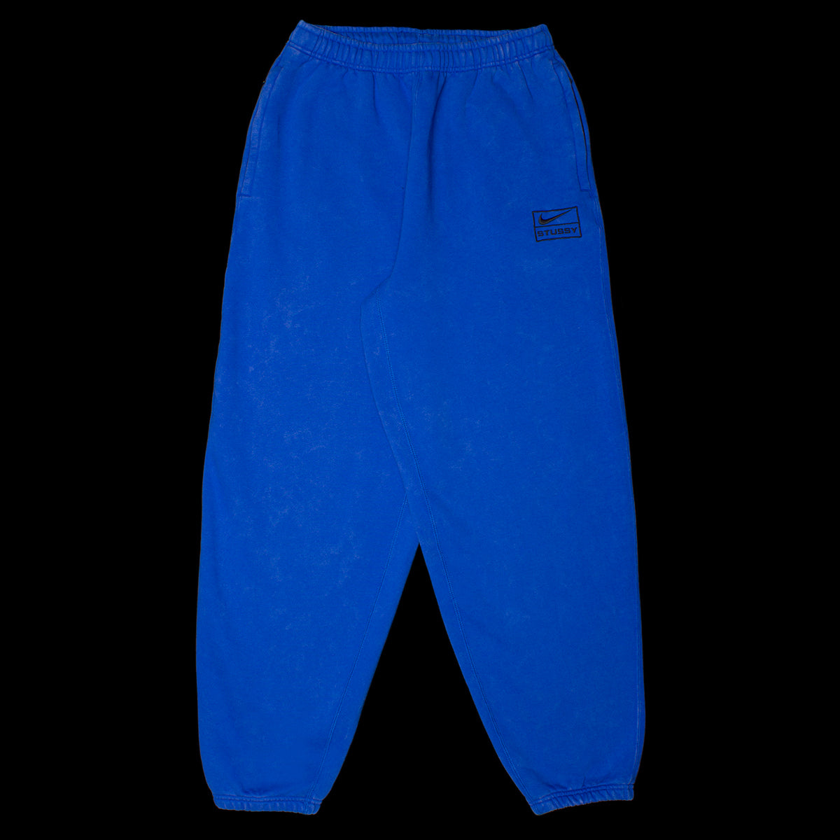 http://thepremierstore.com/cdn/shop/products/2-9-23-Stussy-Nike-Sweatpant-Blue-1.jpg?v=1676313003