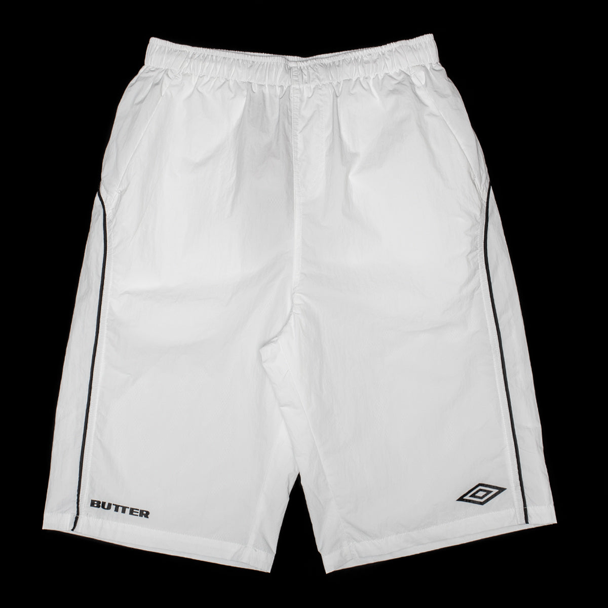 Butter Goods - Long Track Shorts x Umbro
Color : White