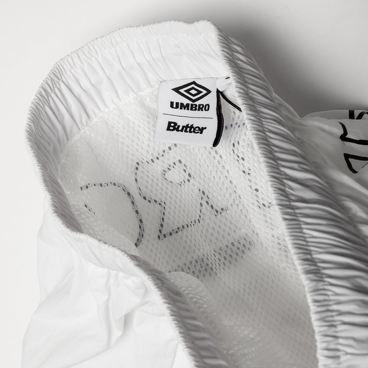 Butter Goods - Long Track Shorts x Umbro
Color : White