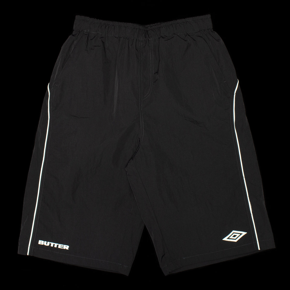 Butter Goods - Long Track Shorts x Umbro
Color : Black