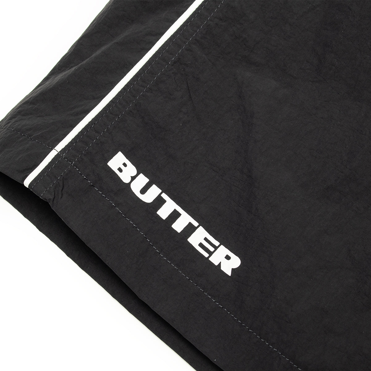 Butter Goods - Long Track Shorts x Umbro
Color : Black