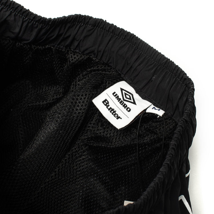 Butter Goods - Long Track Shorts x Umbro
Color : Black
