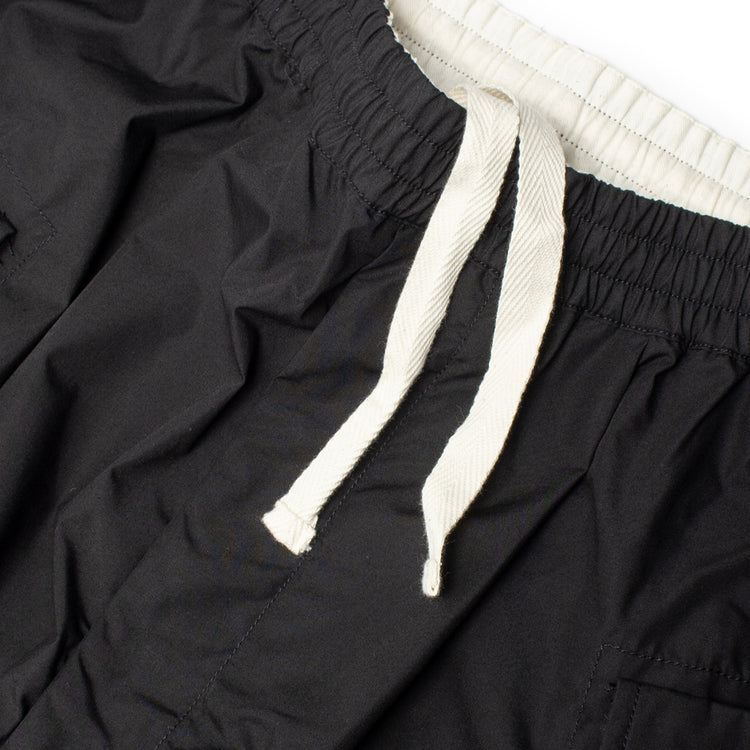 Nanamica - Cargo Deck Pants
Style # S25SC006U
Color : Black