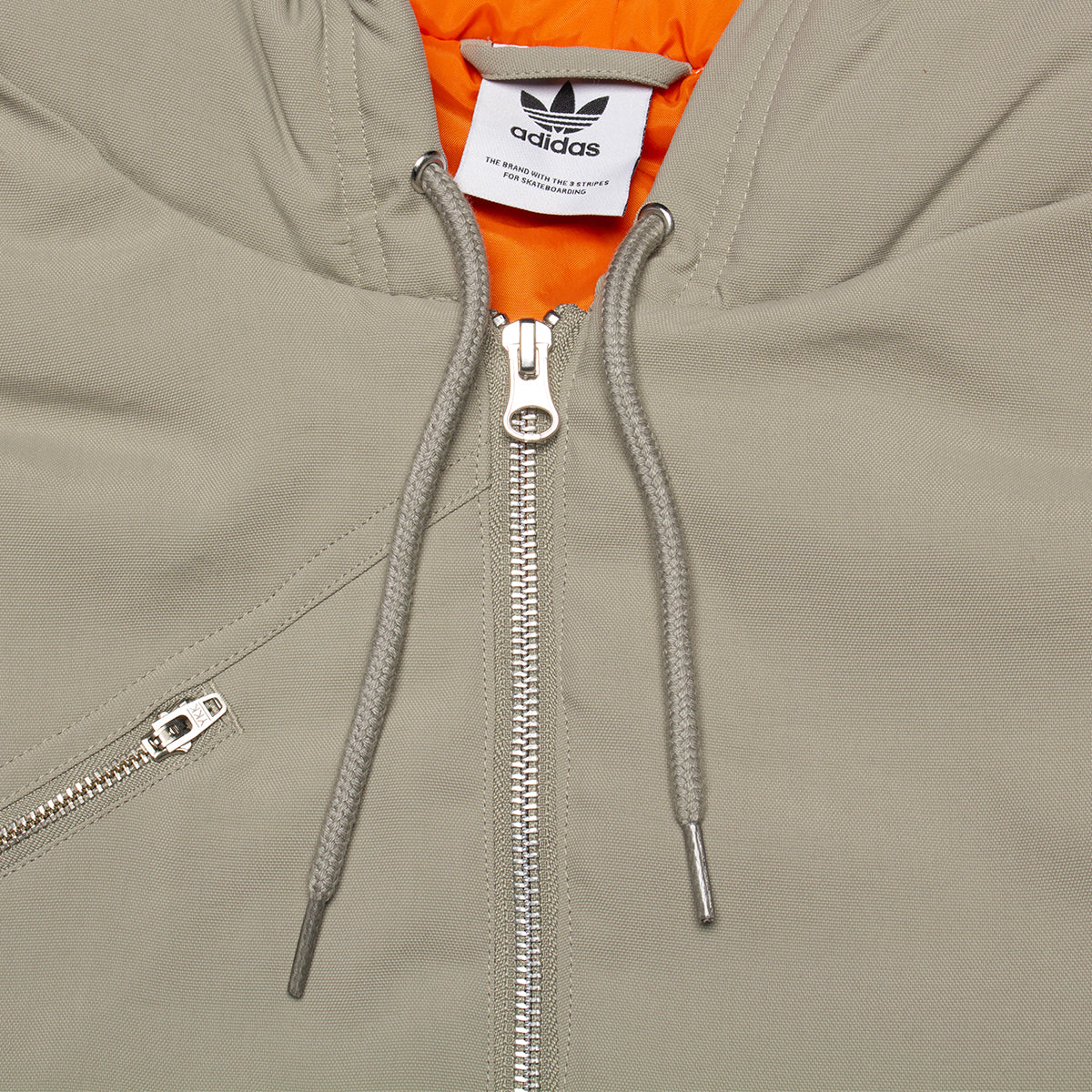 Adidas | Shmoofoil Nylon Canvas Jacket
Style # IX9021
Color : Silver Pebble / Collegiate Orange