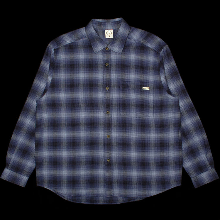 Polar Skate Co. - Mitchell L/S Shirt
Color : Blue
Materials : 100% Brushed Cotton Twill
Garment washed
Dropped shoulders
Loose fit

Custom faux tortoise buttons
Made in Portugal