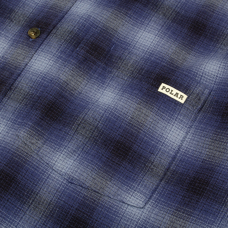 Polar Skate Co. - Mitchell L/S Shirt
Color : Blue
Materials : 100% Brushed Cotton Twill
Garment washed
Dropped shoulders
Loose fit

Custom faux tortoise buttons
Made in Portugal