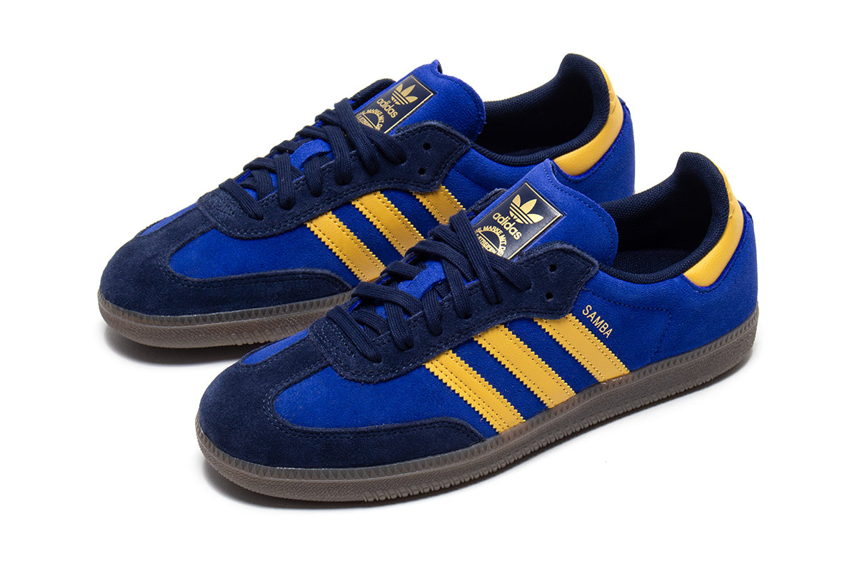 Adidas - Samba ADV
Style # HQ9283
Color : Navy / Yellow / Royal Blue
Materials : Suede Upper - Rubber Outsole
Sizing : US Men's
Cupsole construction