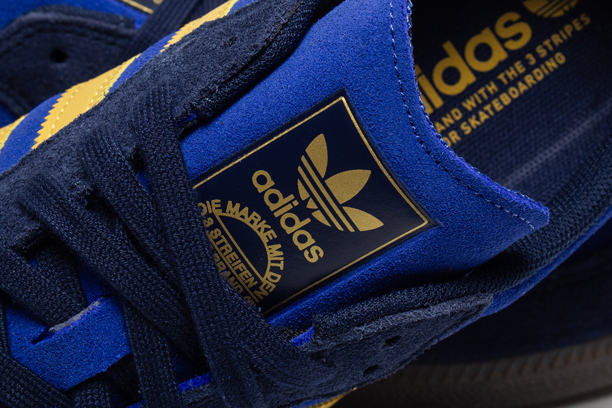 Adidas - Samba ADV
Style # HQ9283
Color : Navy / Yellow / Royal Blue
Materials : Suede Upper - Rubber Outsole
Sizing : US Men's
Cupsole construction