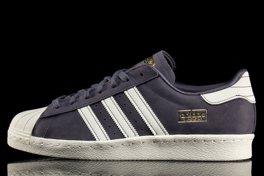 Adidas - Superstar 80 ADV
Style # HQ9289
Color : Grey / White
Materials : Leather / Suede Upper - Rubber Outsole
Sizing : US Men's
Cupsole construction