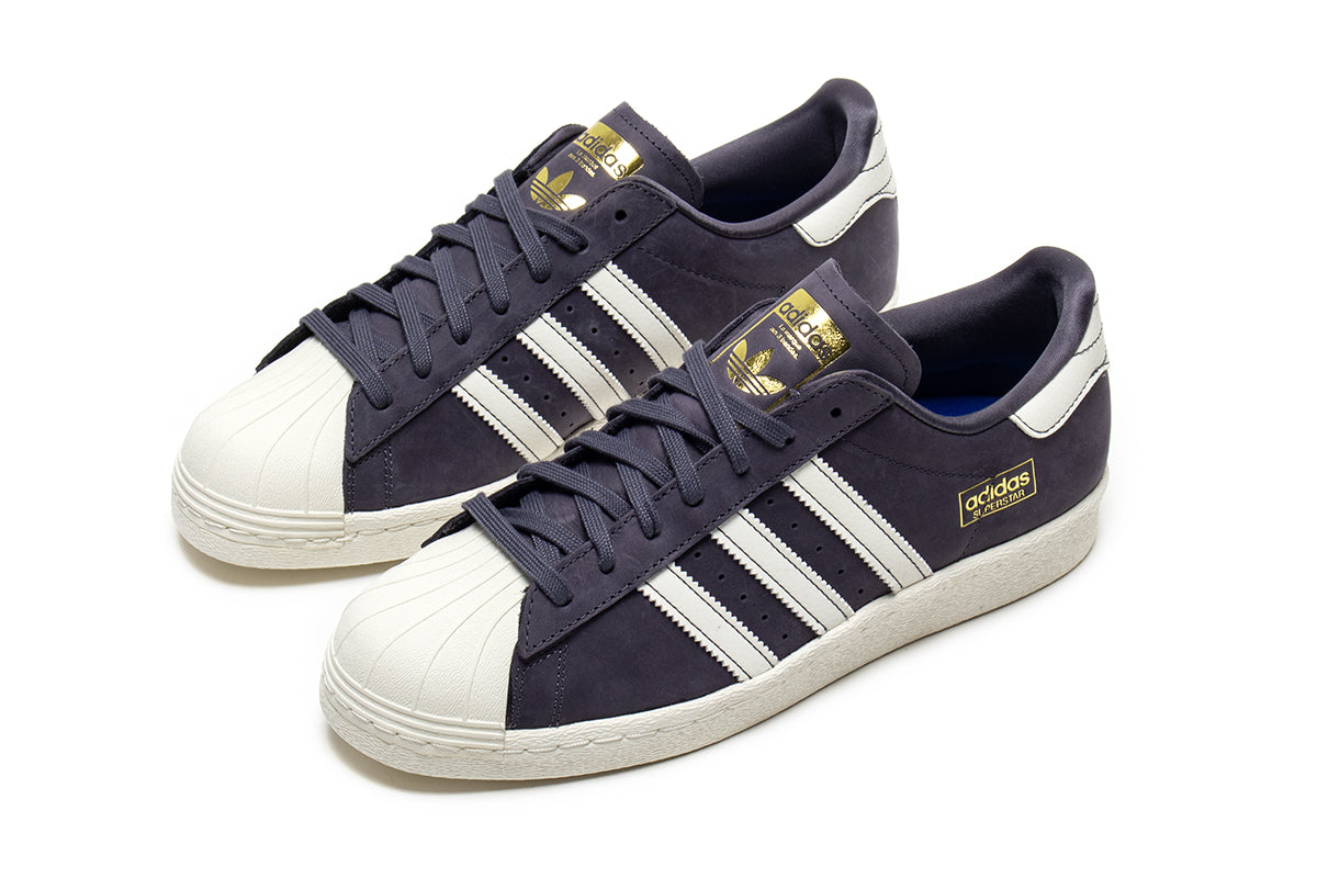 Adidas - Superstar 80 ADV
Style # HQ9289
Color : Grey / White
Materials : Leather / Suede Upper - Rubber Outsole
Sizing : US Men's
Cupsole construction