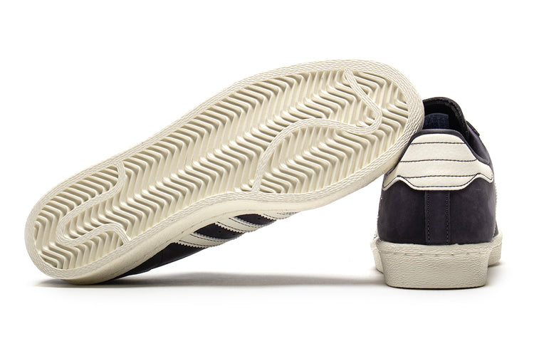 Adidas - Superstar 80 ADV
Style # HQ9289
Color : Grey / White
Materials : Leather / Suede Upper - Rubber Outsole
Sizing : US Men's
Cupsole construction