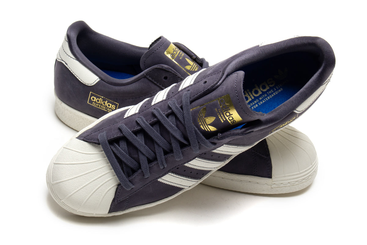 Adidas - Superstar 80 ADV
Style # HQ9289
Color : Grey / White
Materials : Leather / Suede Upper - Rubber Outsole
Sizing : US Men's
Cupsole construction