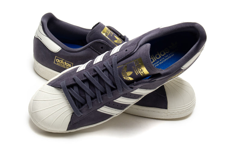 Adidas - Superstar 80 ADV
Style # HQ9289
Color : Grey / White
Materials : Leather / Suede Upper - Rubber Outsole
Sizing : US Men's
Cupsole construction