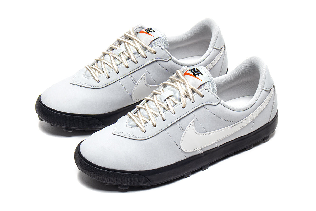 Nike - Astrograbber
Style # IH2341-001
Color : Light Silver / Sail / Phantom / Black
Materials : Leather Upper - Rubber Outsole
Sizing : US Men's