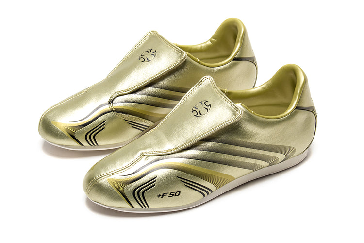 Adidas - Women's Taekwondo F50
Style # IH1872
Color : Gold Metallic / Core Black / Off White
Materials : Leather Upper - Rubber Outsole
Sizing : US Women's