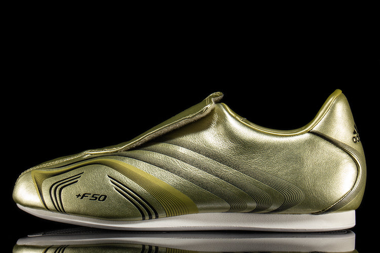 Adidas - Women's Taekwondo F50
Style # IH1872
Color : Gold Metallic / Core Black / Off White
Materials : Leather Upper - Rubber Outsole
Sizing : US Women's