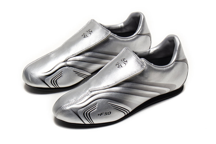 Adidas - Women's Taekwondo F50
Style # IH1873
Color : Silver Metallic / Core Black
Materials : Leather Upper - Rubber Outsole
Sizing : US Women's