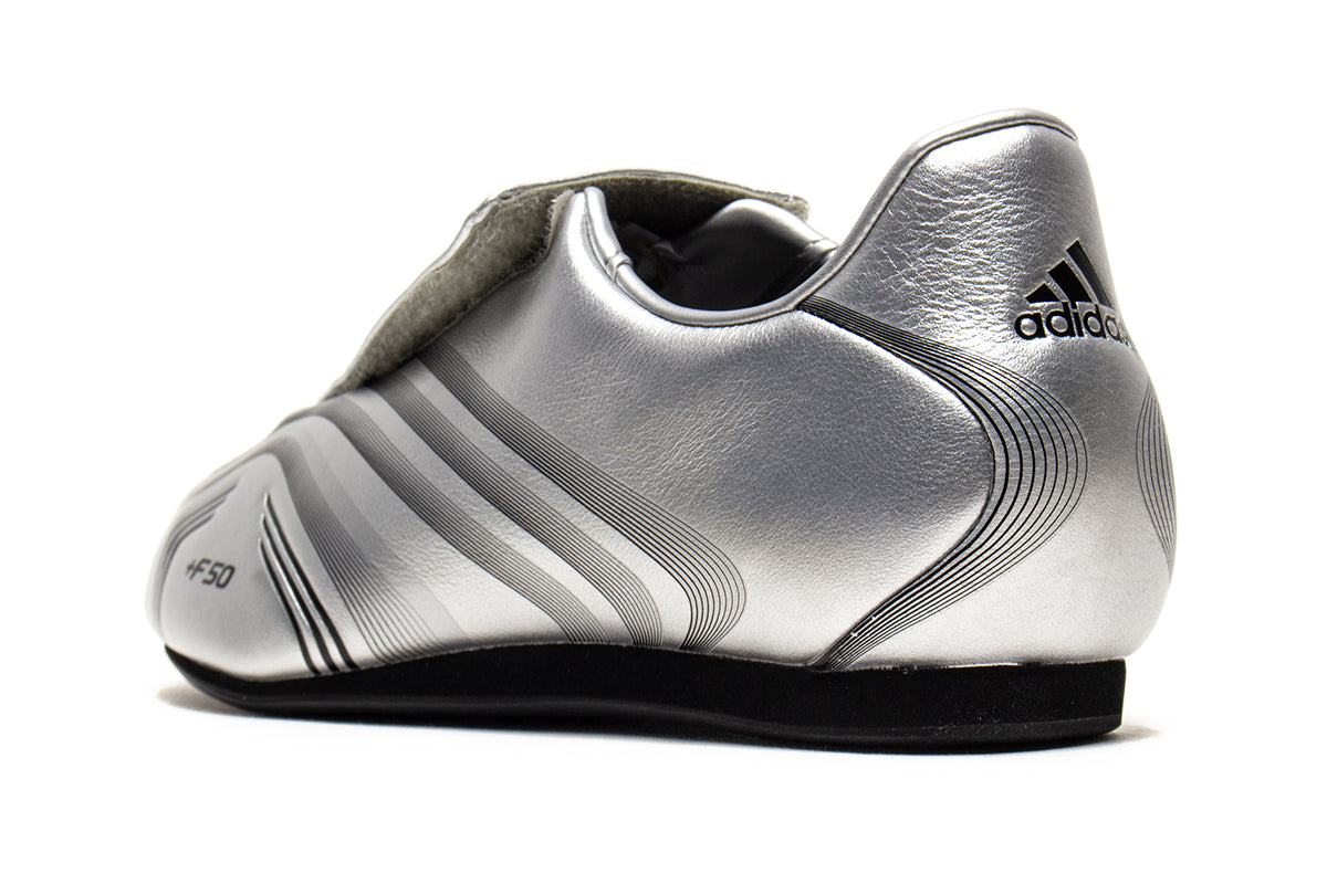 Adidas - Women's Taekwondo F50
Style # IH1873
Color : Silver Metallic / Core Black
Materials : Leather Upper - Rubber Outsole
Sizing : US Women's