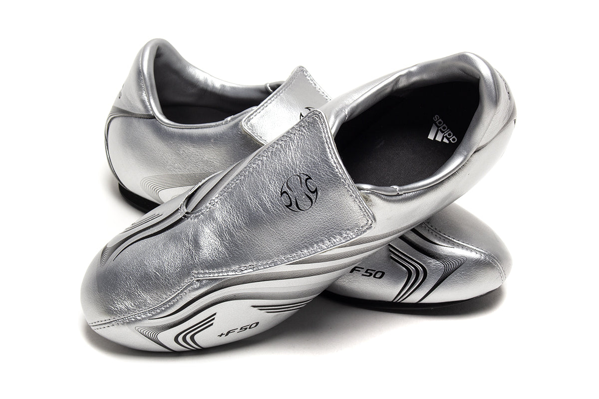 Adidas - Women's Taekwondo F50
Style # IH1873
Color : Silver Metallic / Core Black
Materials : Leather Upper - Rubber Outsole
Sizing : US Women's