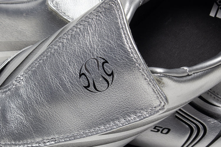 Adidas - Women's Taekwondo F50
Style # IH1873
Color : Silver Metallic / Core Black
Materials : Leather Upper - Rubber Outsole
Sizing : US Women's