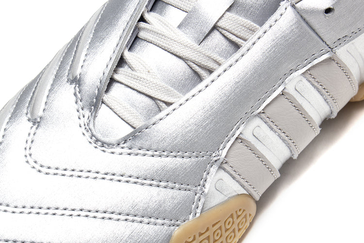 Adidas - Women's Taekwondo Mei Elite
Style # IH9387
Color : Silver Metallic / Grey One / Gum
Materials : Leather Upper - Rubber Outsole
Sizing : US Women's