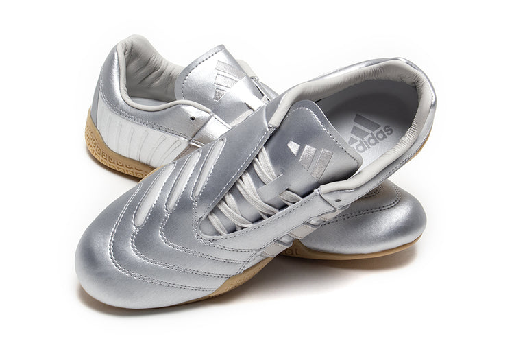 Adidas - Women's Taekwondo Mei Elite
Style # IH9387
Color : Silver Metallic / Grey One / Gum
Materials : Leather Upper - Rubber Outsole
Sizing : US Women's