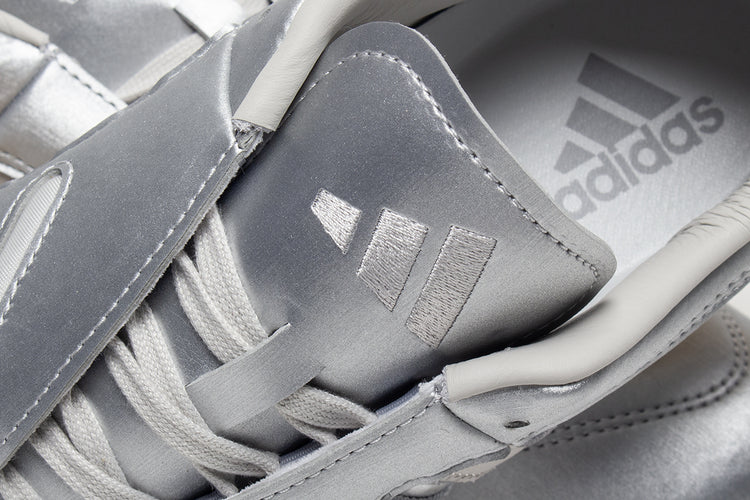 Adidas - Women's Taekwondo Mei Elite
Style # IH9387
Color : Silver Metallic / Grey One / Gum
Materials : Leather Upper - Rubber Outsole
Sizing : US Women's