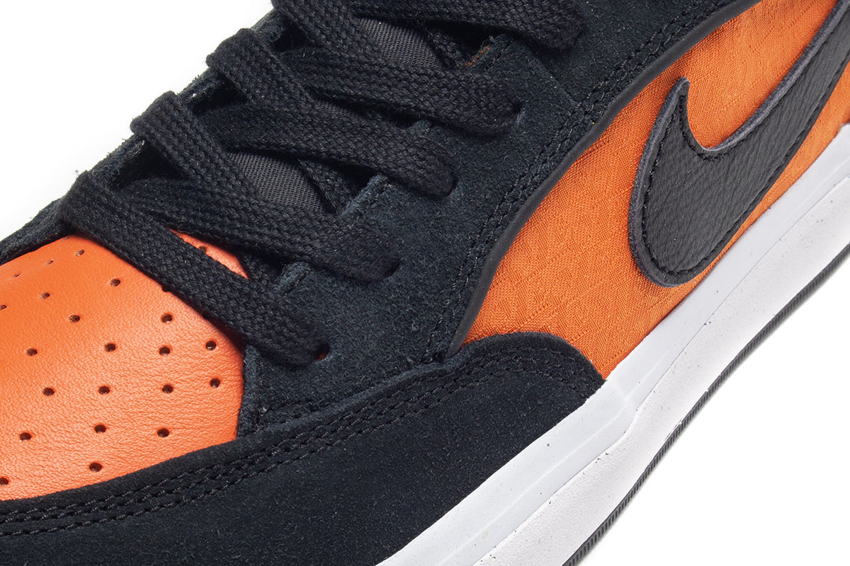 Nike SB | React Leo Style # DX4361-002 Color : Black / Orange