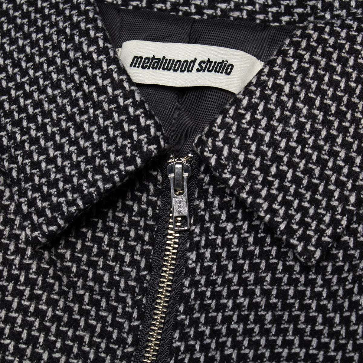 Metalwood - Mechanic Jacket
Color : Black
Materials : 100% Melton Wool - Poly Fiil

2-way front zip closure
Side hand pockets
Metal charm on back neck
Ribbed cuffs