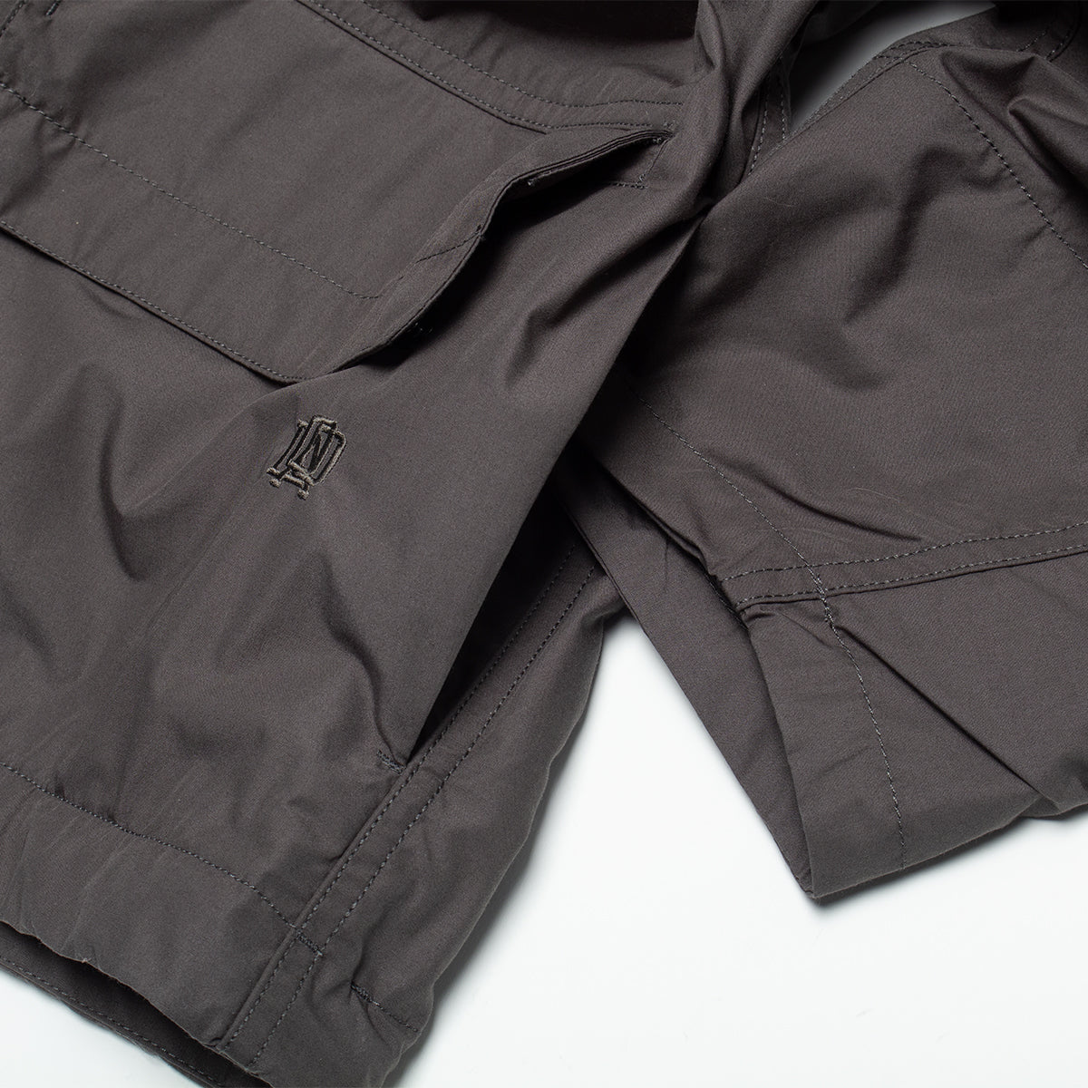 Nanamica - Hooded Deck Jacket
Style # S25FA012U
Color : Charcoal