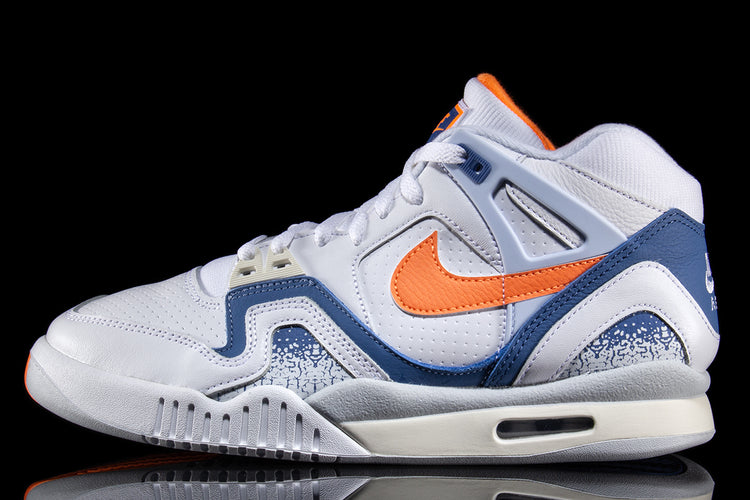 Nike - Air Tech Challenge II
Style # FZ9033-101
Color : White / Tart / Stone Blue / Football Grey