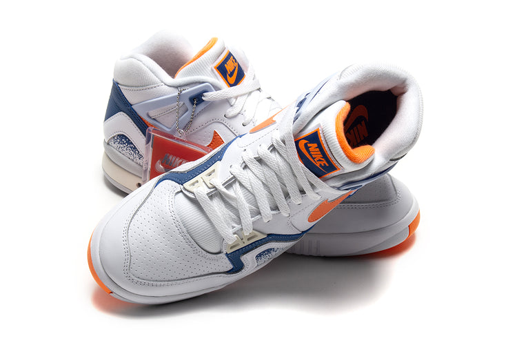 Nike - Air Tech Challenge II
Style # FZ9033-101
Color : White / Tart / Stone Blue / Football Grey