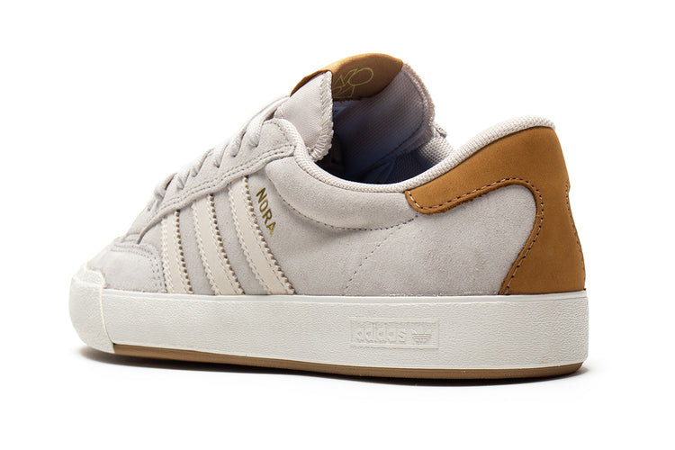 Adidas - Nora
Style # JP8594
Color : Aluminum / Core White / Gold Metallic