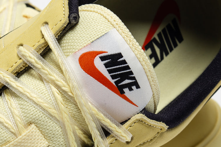 Nike - Astrograbber
Style # IH2341-700
Color : Soft Yellow / Black / Sail / Safety Orange