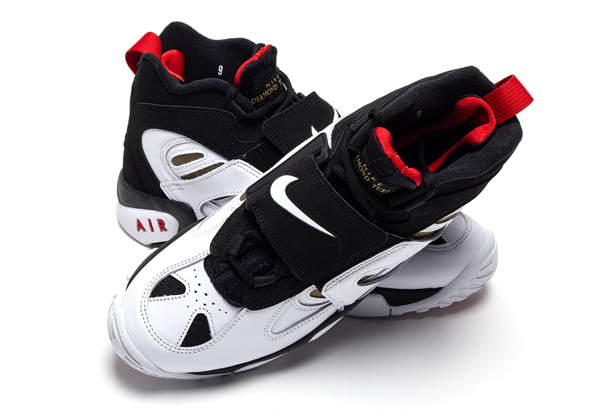 Nike - Air Diamond Turf II
Style # II7080-001
Color : Black / White / Fire Red / Metallic Gold