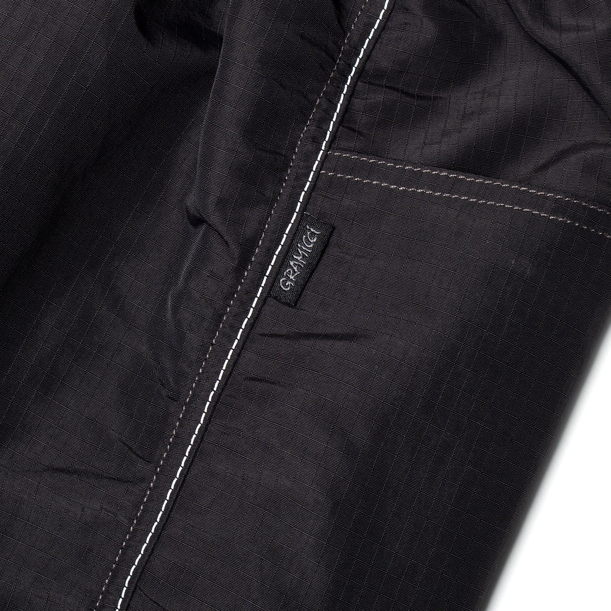 Gramicci x And Wander Ripstop Voyager Pants
Color : Black