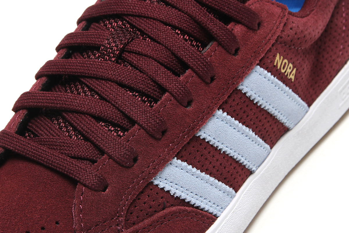 Adidas - Nora
Style # HQ4698
Color : Maroon / Clear Sky / Cloud White