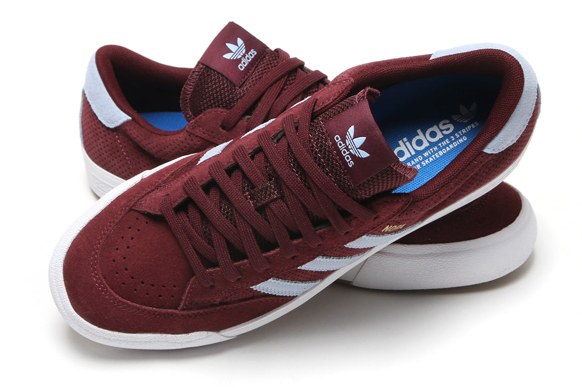 Adidas - Nora
Style # HQ4698
Color : Maroon / Clear Sky / Cloud White
