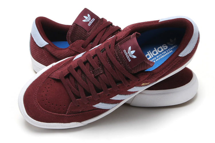 Adidas - Nora
Style # HQ4698
Color : Maroon / Clear Sky / Cloud White