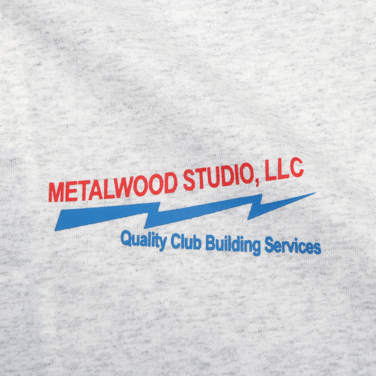 Metalwood - Club Building T-Shirt
Color : Heather Grey