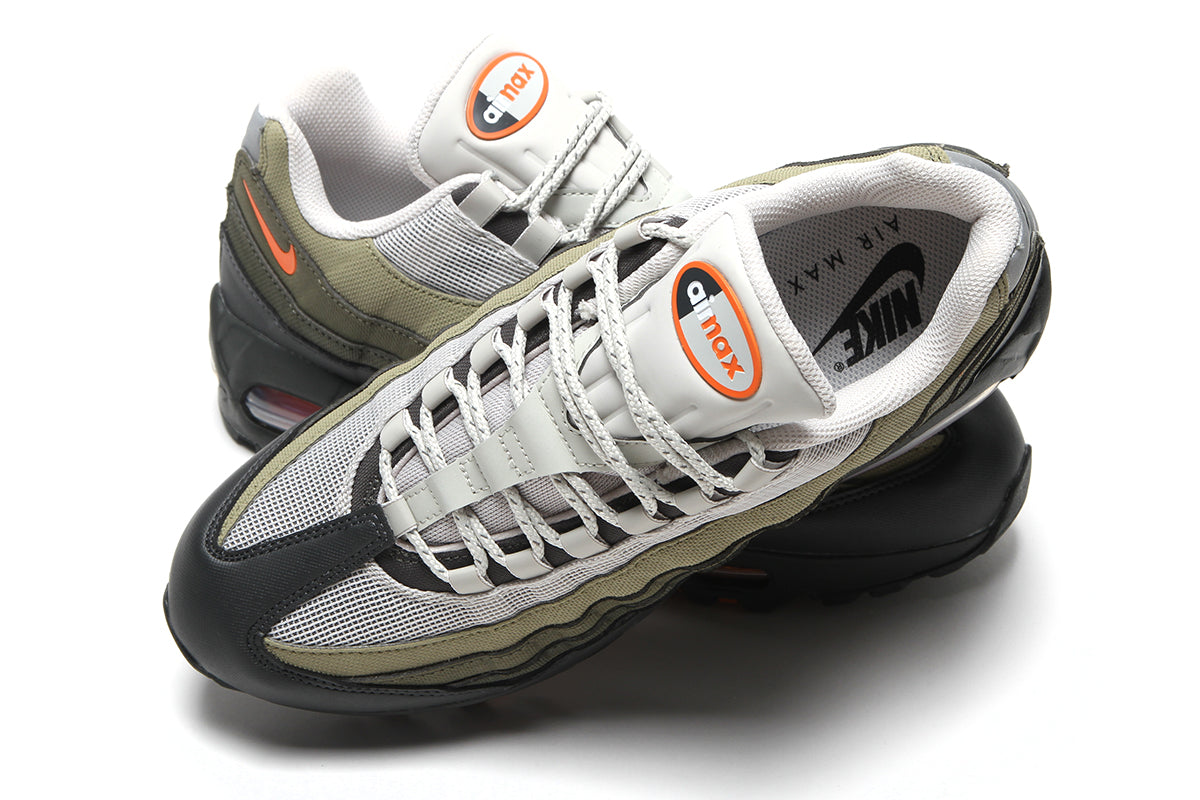 Nike - Air Max 95 Big Bubble
Style # IQ7128-003
Color : Light Bone / Safety Orange / Anthracite