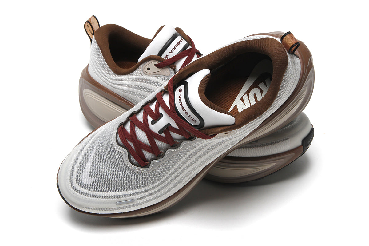 Nike - Vomero Plus
Style # IO4482-100
Color : Sail / Pecan / Caldera Brown / Black