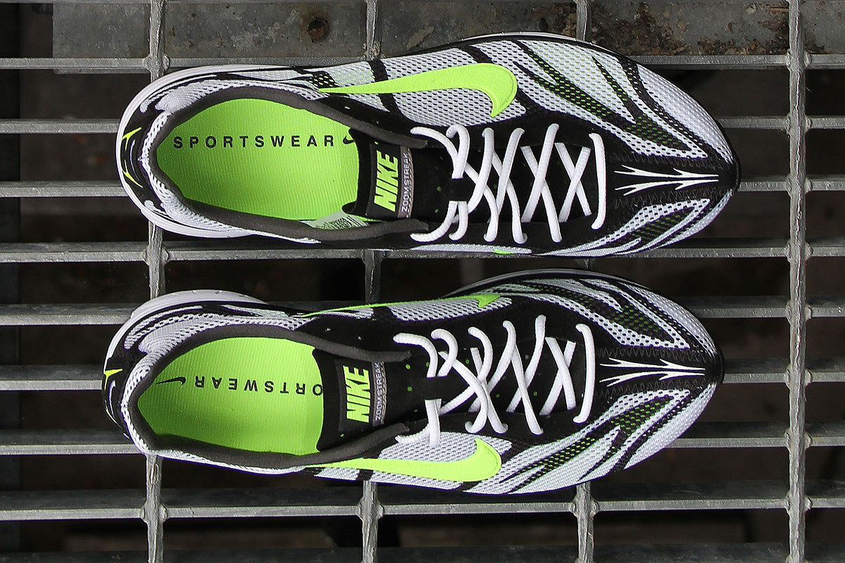 Nike - Zoom Streak 3
Style # IQ8012-100
Color : White / Volt / Flat Pewter / Black